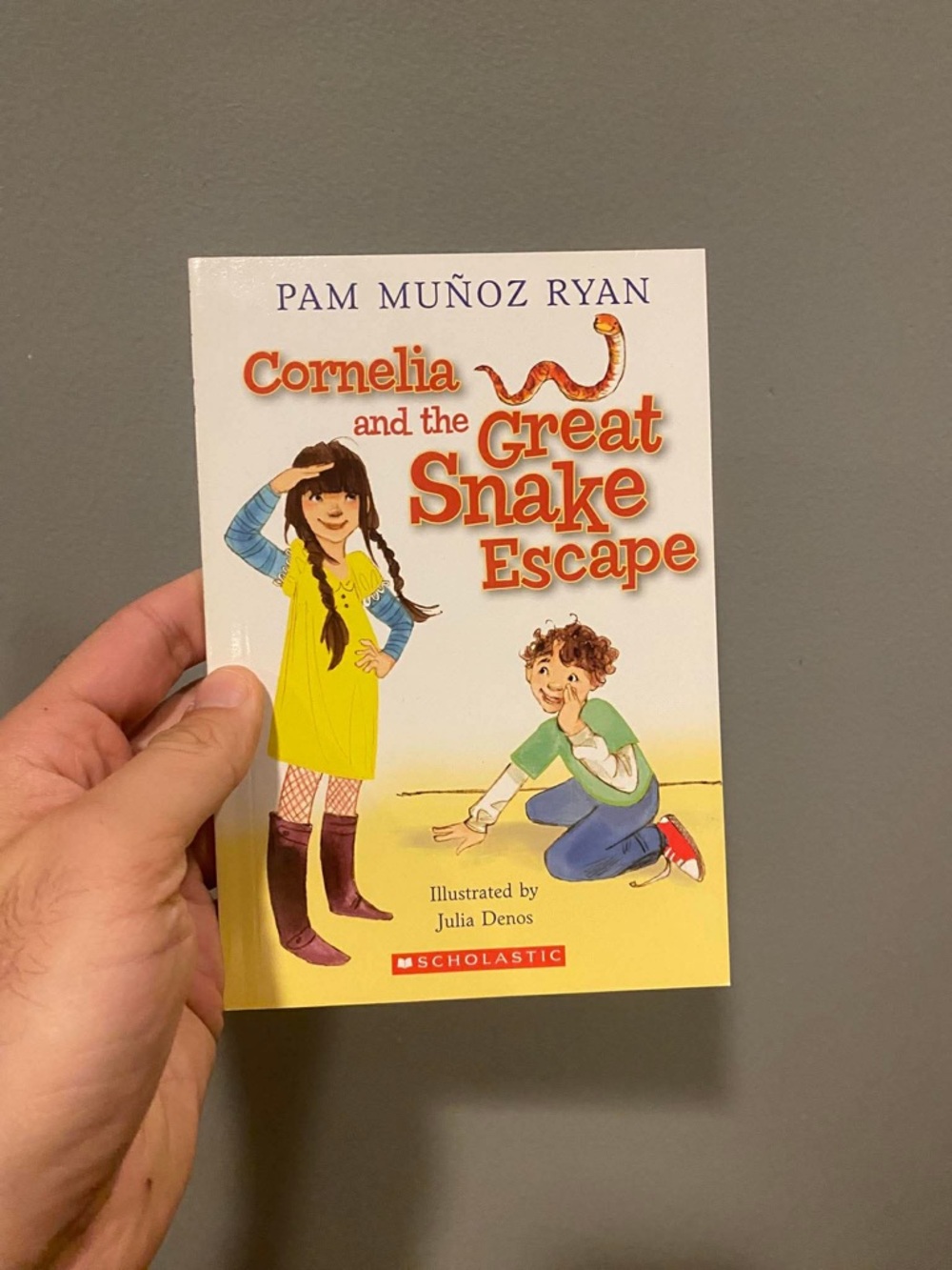 Scholastic paperback with green and orange accents